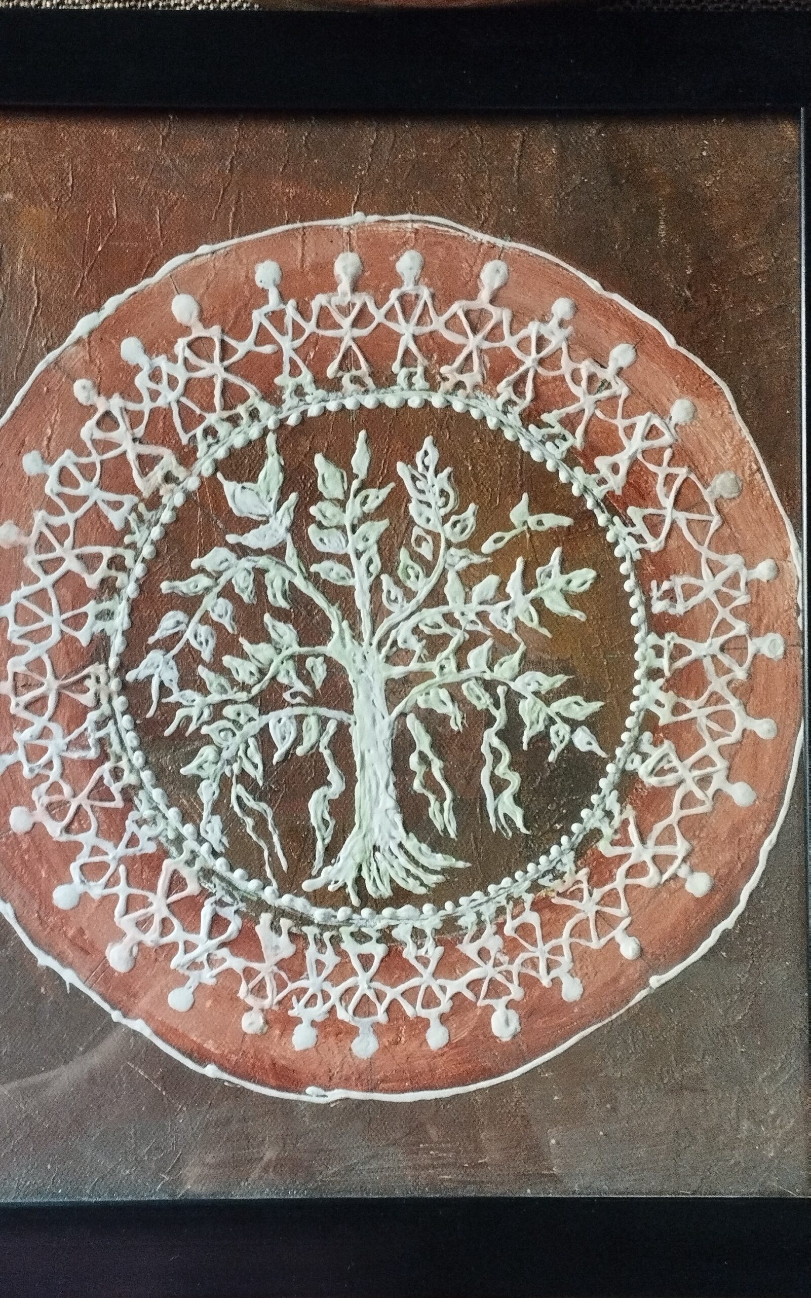 Warli artwork by Minakshi showing Tree of life. The motif is a common one in warli paintings